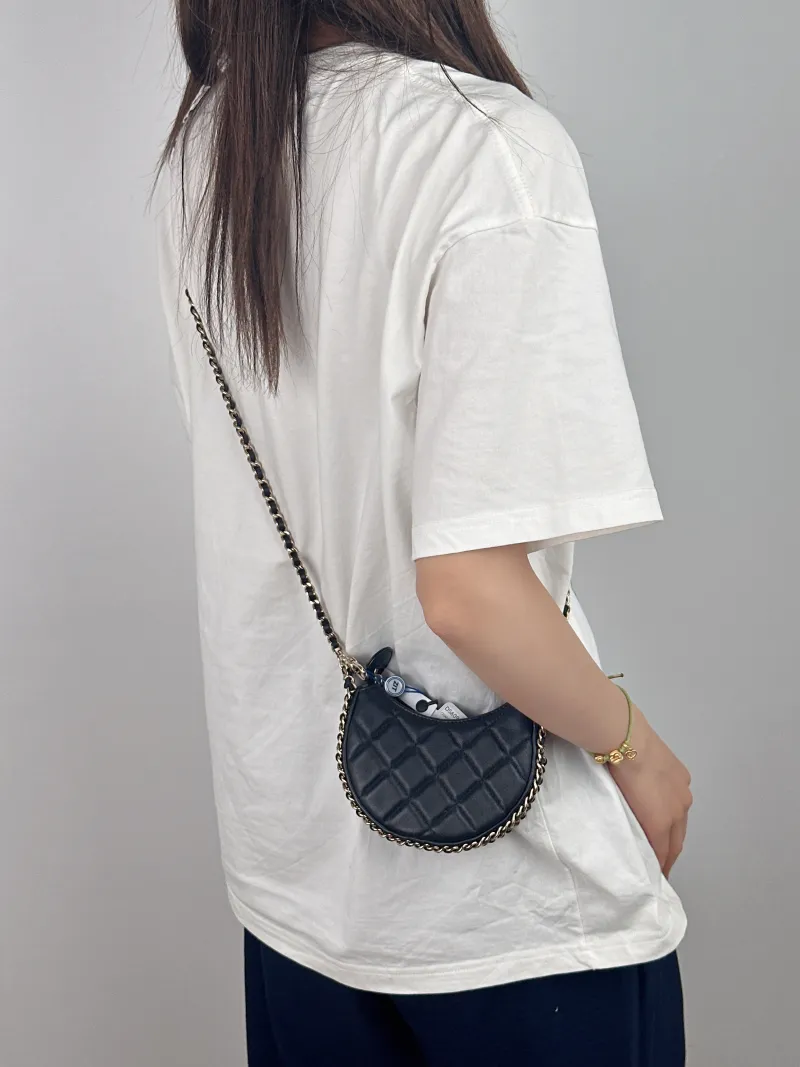 Chanel Crossbody Bag 23p Black Lambskin Mini 13.5 × 5 × 9.5 cm — on-model view 1 of 2