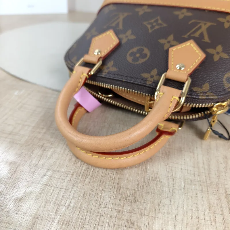Louis Vuitton Crossbody Bag Alma Nano Monogram PVC nano 18 × 8 × 12 cm — detail view 7 of 10