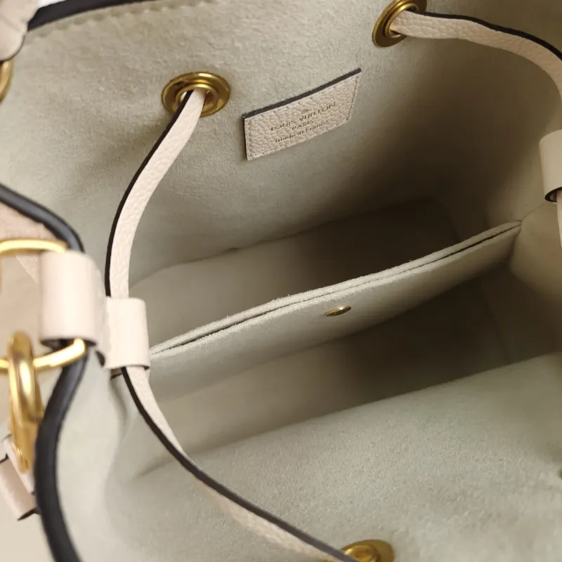 Louis Vuitton Crossbody Bag NÉONOÉ Bucket Bag BB Monogram Empreinte Embossed Calfskin BB 20 × 13 × 20 cm Conditioned — detail view 1 of 11
