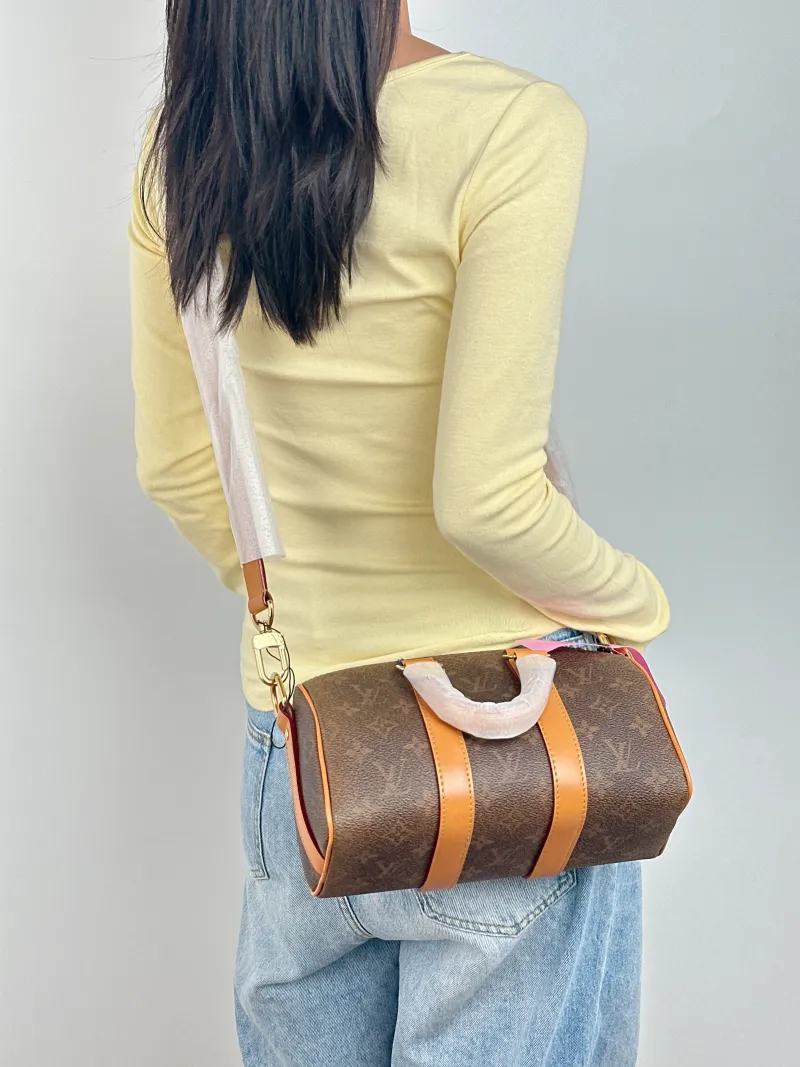Louis Vuitton Crossbody Bag Keepall 25 Edition Brown PVC Medium 25 × 11 × 15 cm — on-model view 3 of 3