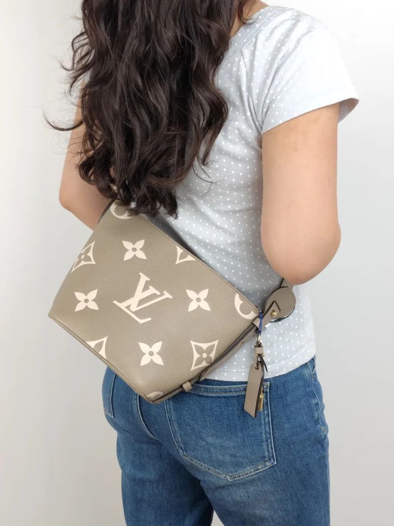 Louis Vuitton Top Handle Bag ALL IN BB · White Empreinte Embossed Calfskin BB 16 × 12 × 18 cm — on-model view 1 of 2