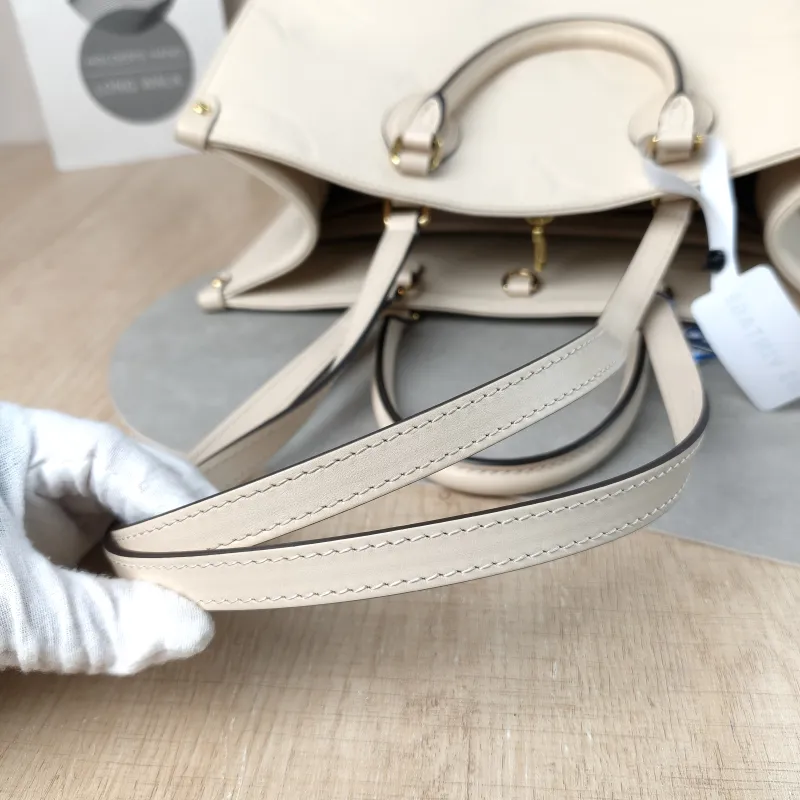 Louis Vuitton Shoulder Bag Onthego Medium White Monogram Empreinte Embossed Calfskin Medium 35 × 14 × 27 cm — detail view 7 of 12