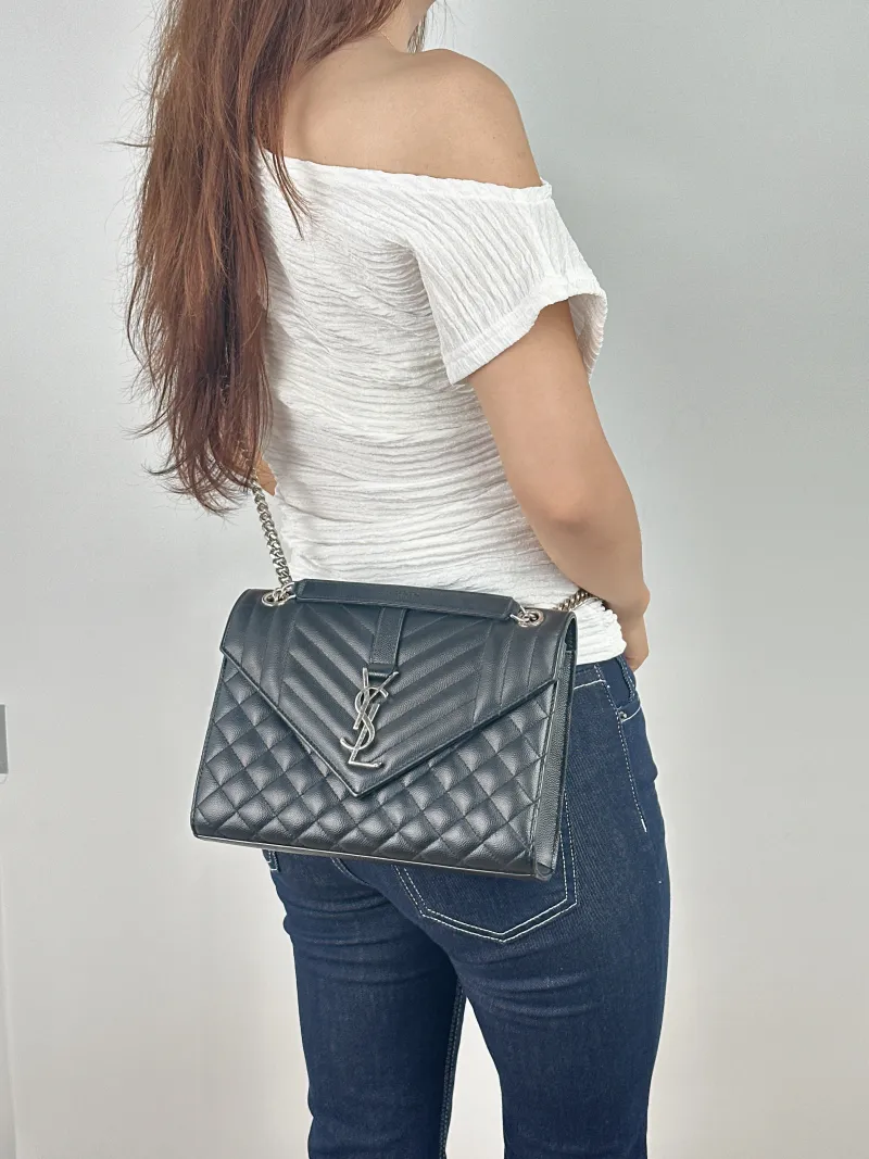 SAINT LAURENT Crossbody Bag ENVELOPE Black Calfskin Medium24 × 6 × 17.5 cm — on-model view 1 of 2