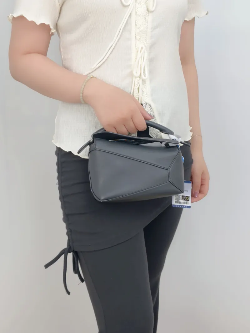 LOEWE Crossbody Bag Puzzle Black CC alfskinmini18 × 8 × 12.5 cm — on-model view 2 of 3