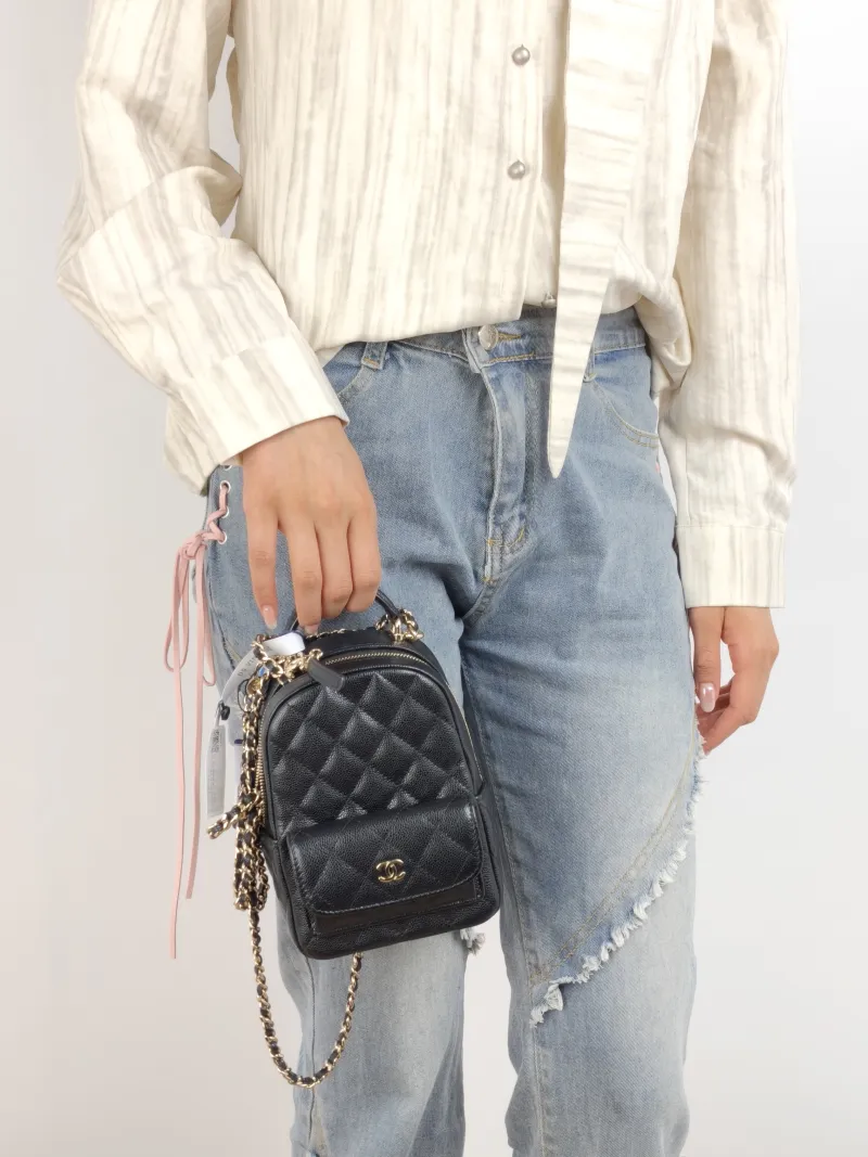 Chanel Crossbody Bag Mini Backpack Crossbody Bag Black Grained Calfskin 13 × 9 × 18 cm — on-model view 1 of 2