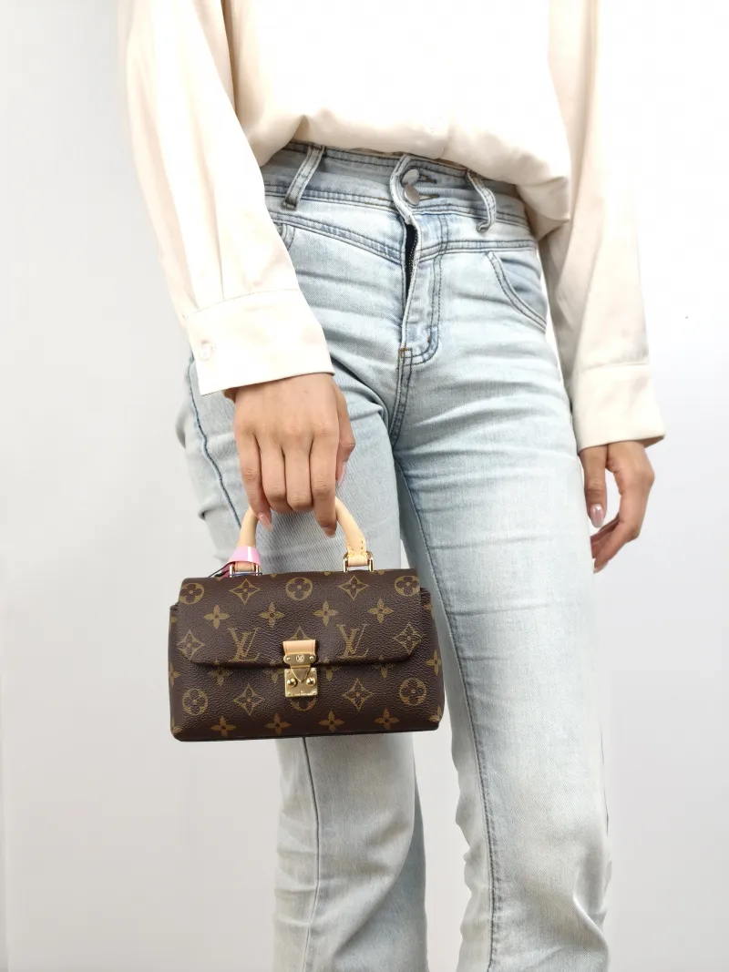 Louis Vuitton Crossbody Bag MADELEINE Monogram PVC nano 21 × 6 × 12.5 cm — on-model view 1 of 2