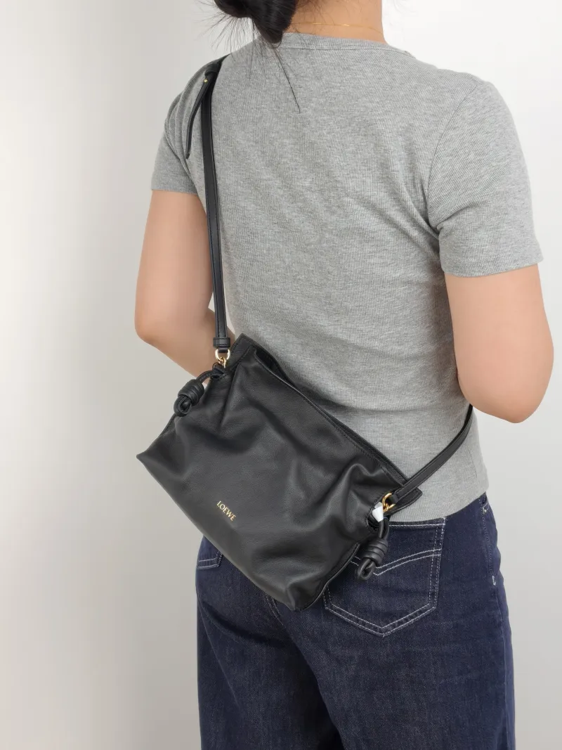 LOEWE Crossbody Bag Flamenco Black Calfskin Mini 24 × 9 × 18 cm — on-model view 1 of 2
