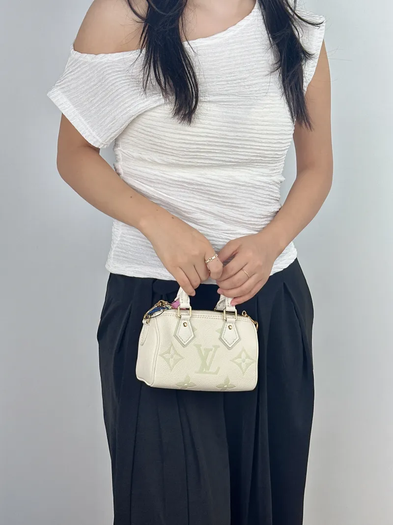 Louis Vuitton Crossbody Bag Speedy Nano White · Green Empreinte Embossed Calfskin nano 16 × 7.5 × 10 cm — on-model view 2 of 2