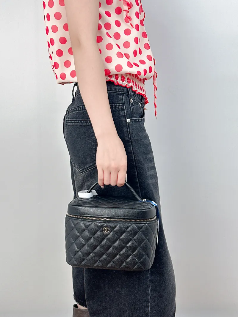 Chanel Top Handle Bag 22C Box Bag Cosmetic Bag Black Grained Calfskin 21 × 14 × 15 cm — on-model view 1 of 2