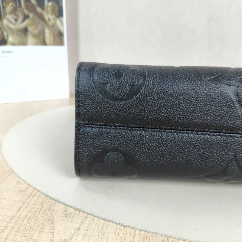 Louis Vuitton Crossbody Bag Onthego East West Two Straps Black Empreinte Embossed Calfskin Small 25 × 10 × 13 cm — detail view 3 of 12