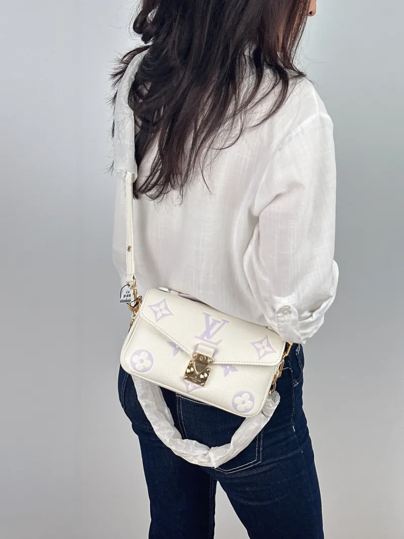 Louis Vuitton Crossbody Bag Pochette Métis East West White · Empreinte Embossed Calfskin Small 21.5 × 6 × 13.5 cm — on-model view 3 of 3