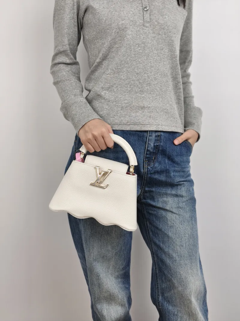 Louis Vuitton Crossbody Bag Capucines White Calfskin Mini 22 × 7.5 × 14 cm — on-model view 2 of 3
