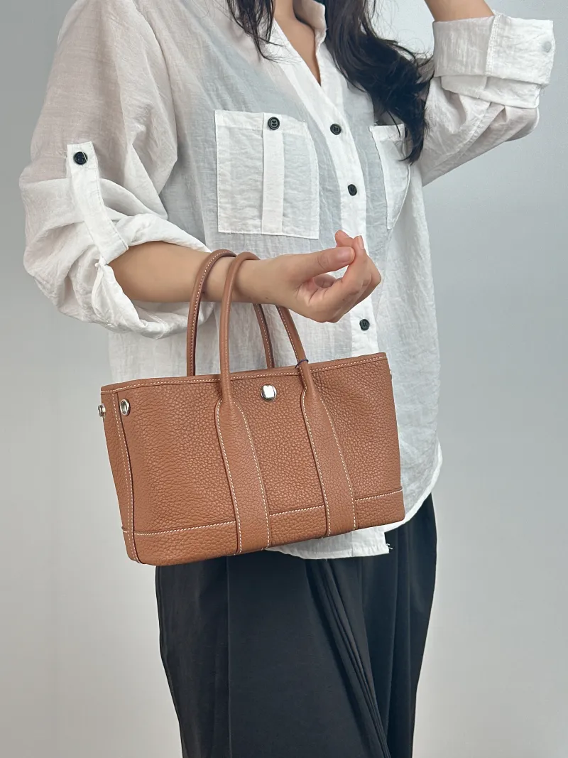 Hermès Top Handle Bag Neo Garden 23 Mini Negonda Calfskin Mini 23 × 10 × 16 cm K — on-model view 1 of 2