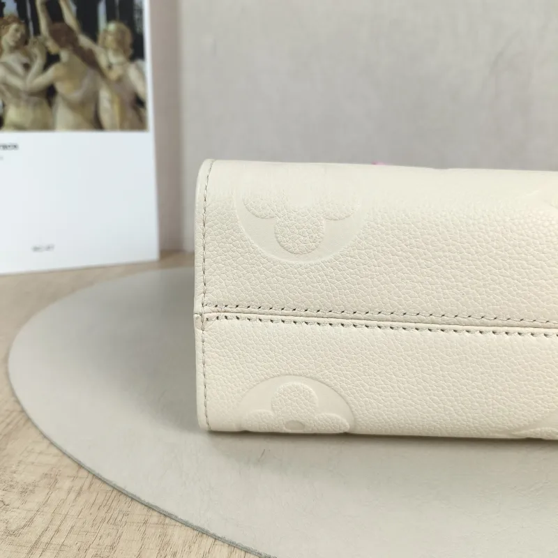 Louis Vuitton Crossbody Bag Onthego East West Two Straps White Empreinte Embossed Calfskin Small 25 × 10 × 13 cm — detail view 1 of 13