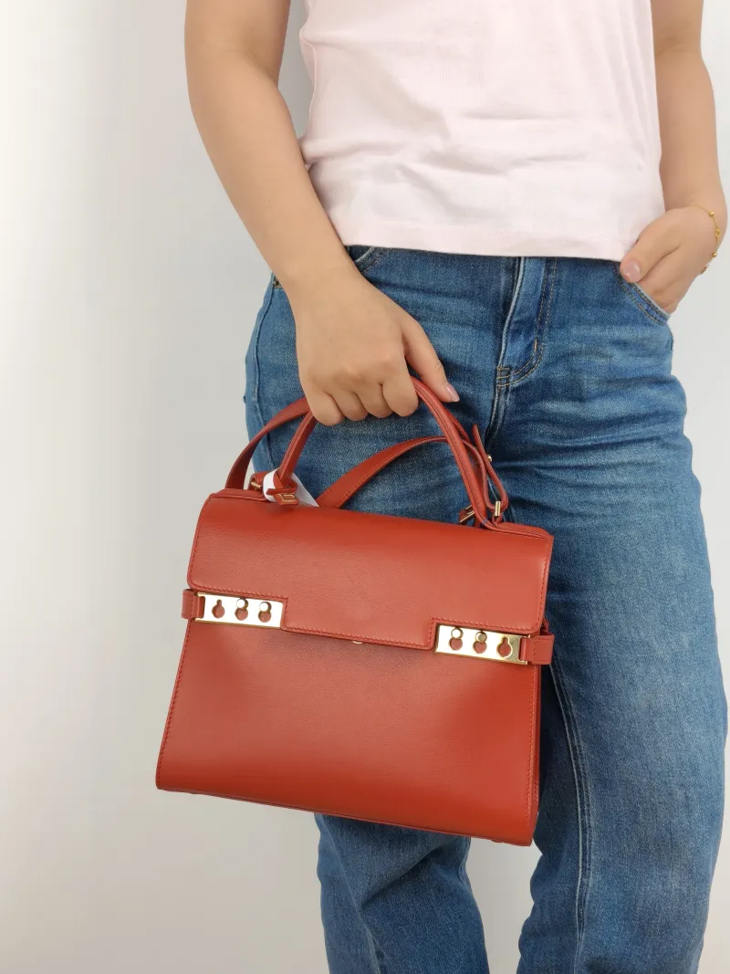 DELVAUX Crossbody Bag Tempete Top Handle Bag Red Calfskin Medium 27.5 × 9 × 23 cm — on-model view 1 of 3