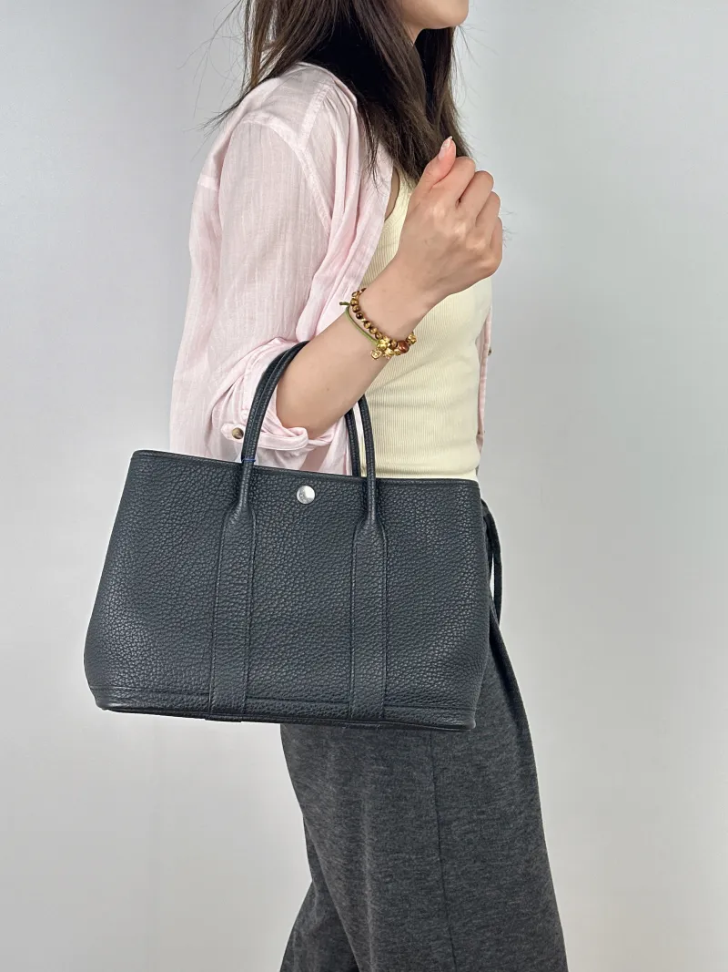 Hermès Top Handle Bag Garden Party 30 30Black Negonda Calfskin Medium30 × 13 × 21 cm — on-model view 1 of 2