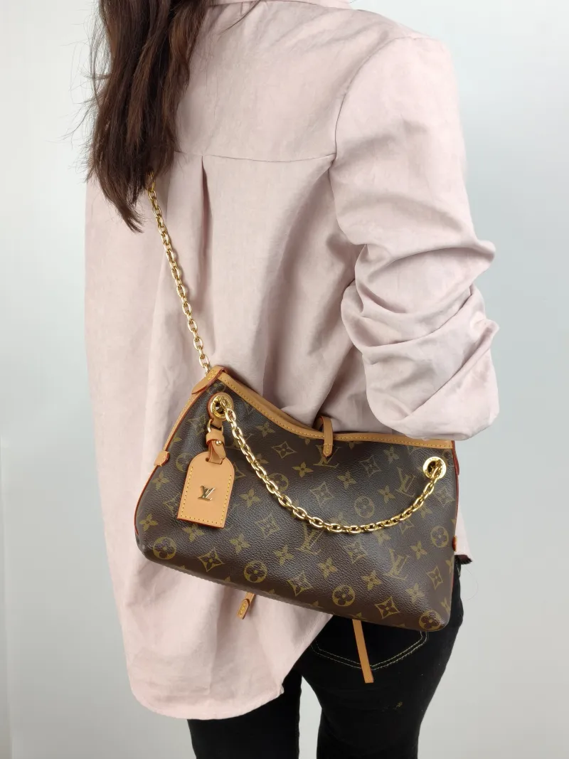 Louis Vuitton Crossbody Bag Carryall BB Monogram PVC BB 26 × 10 × 17 cm — on-model view 1 of 2