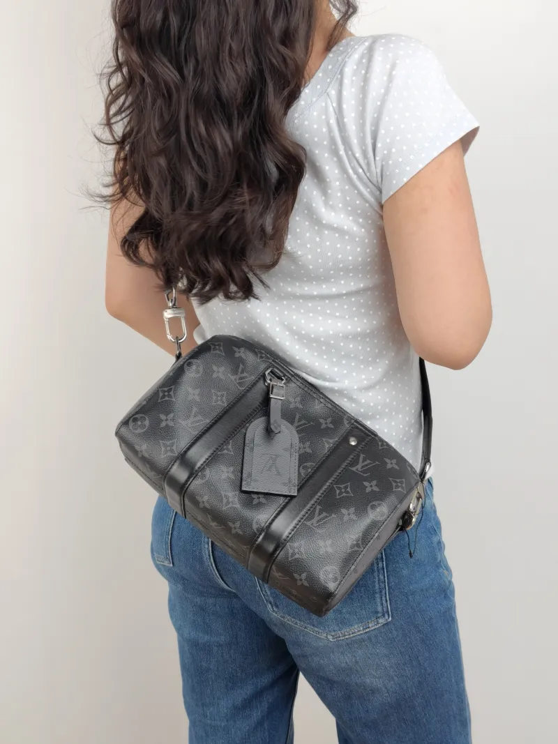 Louis Vuitton Crossbody Bag City Keepall Black PVC Medium 27 × 13 × 17 cm — on-model view 2 of 2