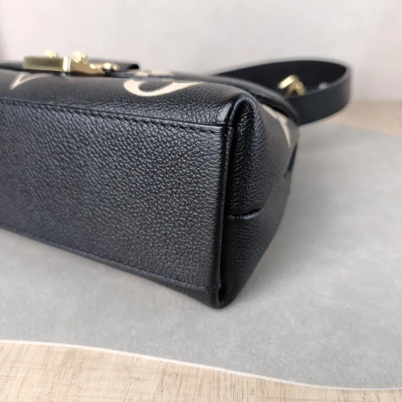 Louis Vuitton Crossbody Bag MADELEINE Black · White Monogram Empreinte Embossed Calfskin BB 24 × 8.5 × 17 cm — detail view 1 of 13