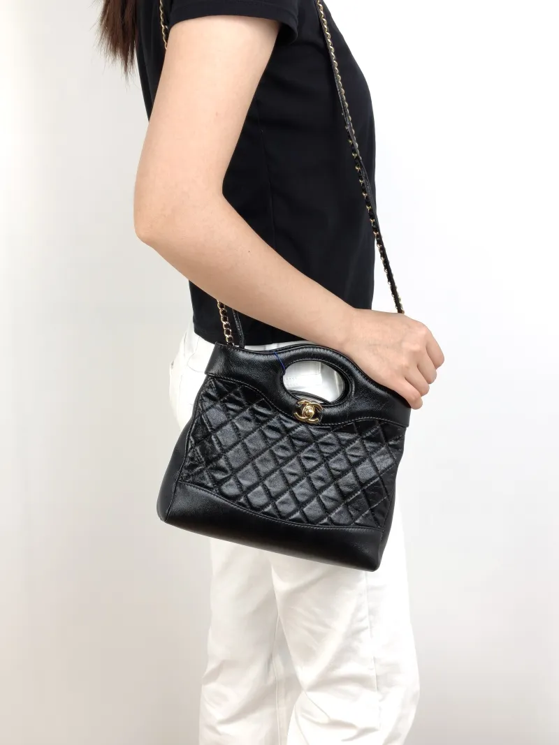Chanel Crossbody Bag31Bag Black Waxed Leathermini23 × 5.5 × 22 cm — on-model view 2 of 3