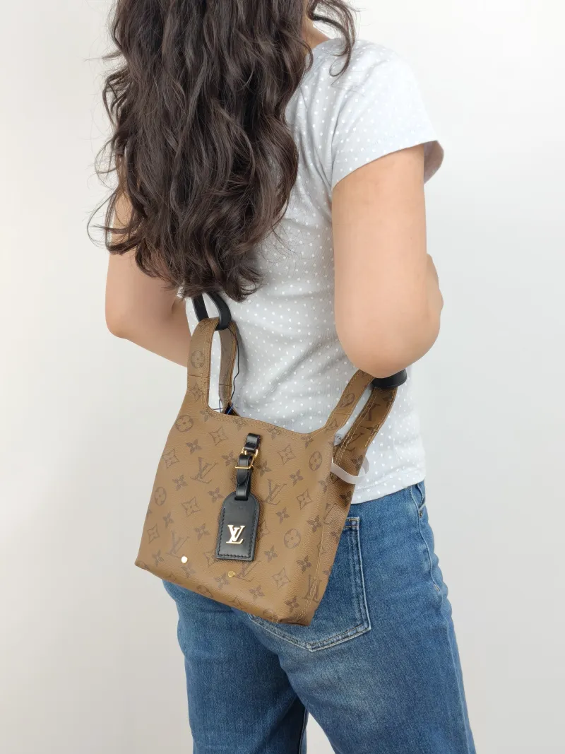 Louis Vuitton Top Handle Bag ATLANTIS Monogram PVC BB 17 × 7 × 17 cm — on-model view 1 of 2