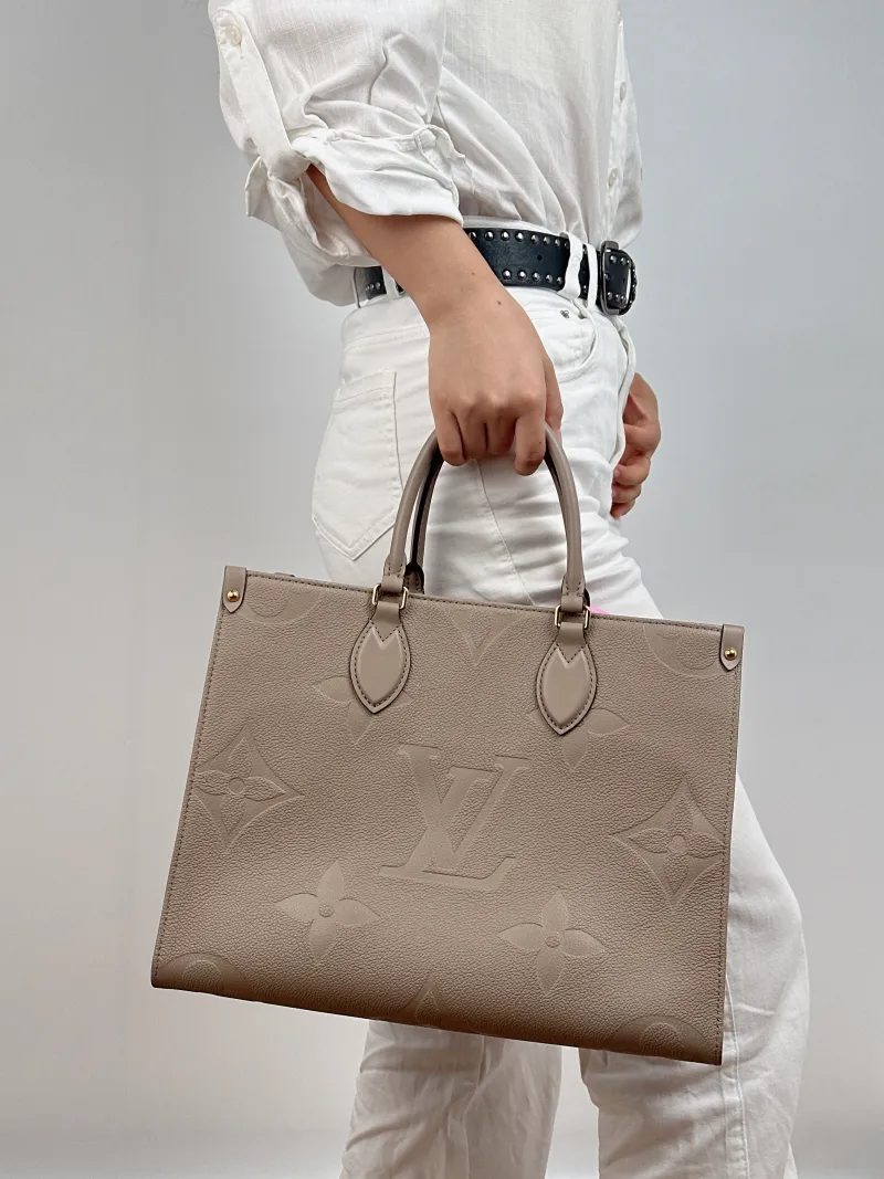 Louis Vuitton Shoulder Bag Onthego Medium Monogram Empreinte Embossed Calfskin Medium 35 × 14 × 27 cm — on-model view 2 of 3