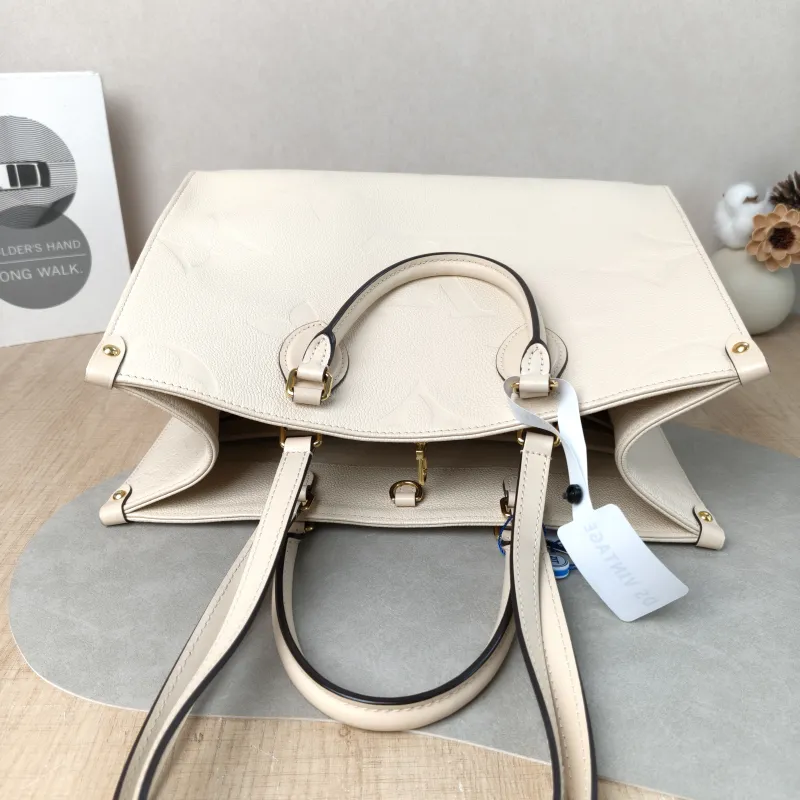 Louis Vuitton Shoulder Bag Onthego Medium White Monogram Empreinte Embossed Calfskin Medium 35 × 14 × 27 cm — detail view 5 of 12