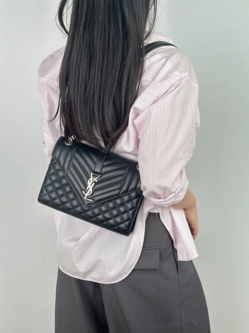 SAINT LAURENT Crossbody Bag ENVELOPE Black Calfskin Medium 24 × 6 × 17.5 cm — on-model view 2 of 2