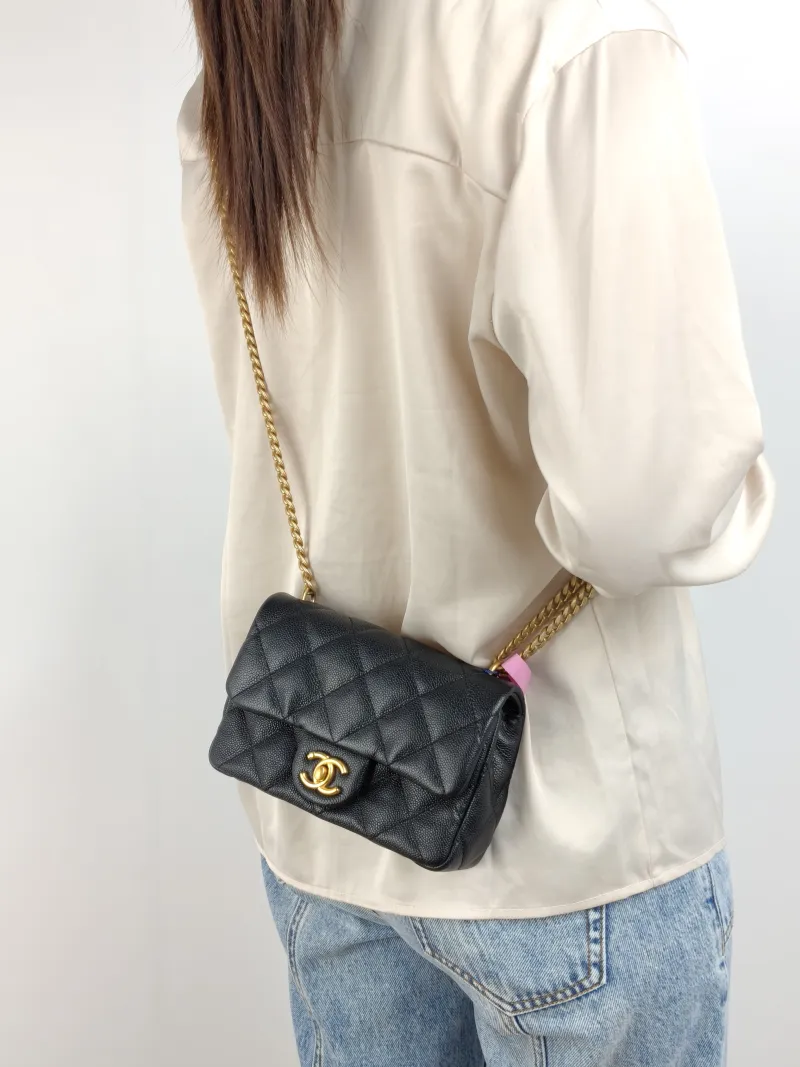 Chanel Crossbody Bag 23p Black Grained Calfskin 18 × 5 × 12 cm — on-model view 2 of 2