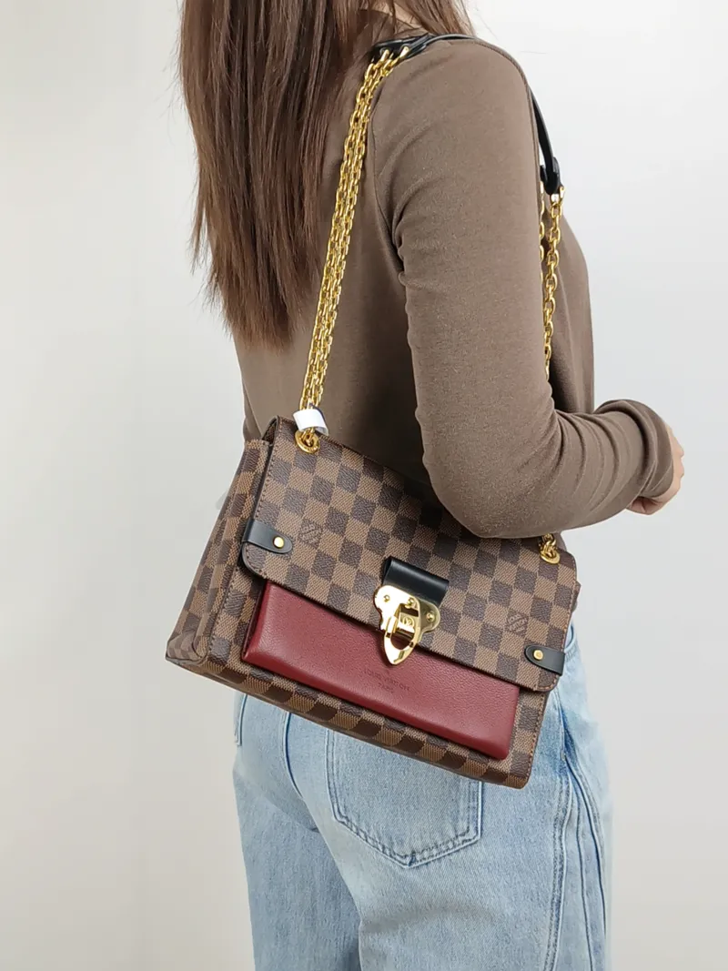 Louis Vuitton Shoulder Bag VAVIN Red · PVC Small 25 × 9.5 × 17 cm — on-model view 1 of 2