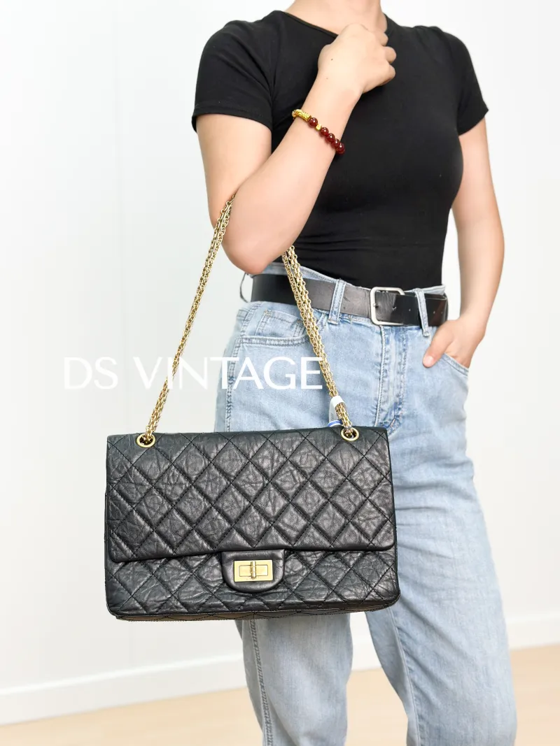 Chanel 2.55 Conditioned Medium Black with Gold-Tone Hardware Calfskin15 · Authenticity Card · 28 × 7.5 × 19.5 cm — on-model view 2 of 3