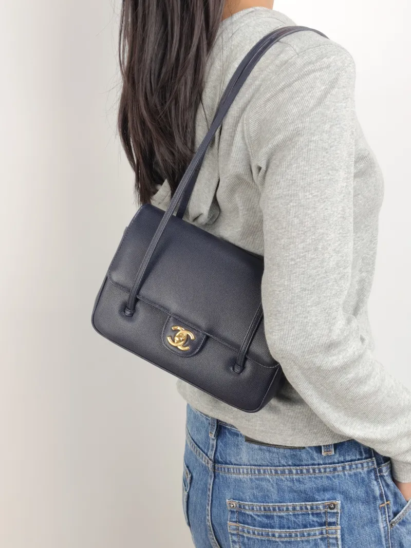 Chanel Shoulder Bag 26p preppy coco Navy Grained Calfskin Small 22 × 7 × 15 cm — on-model view 1 of 2