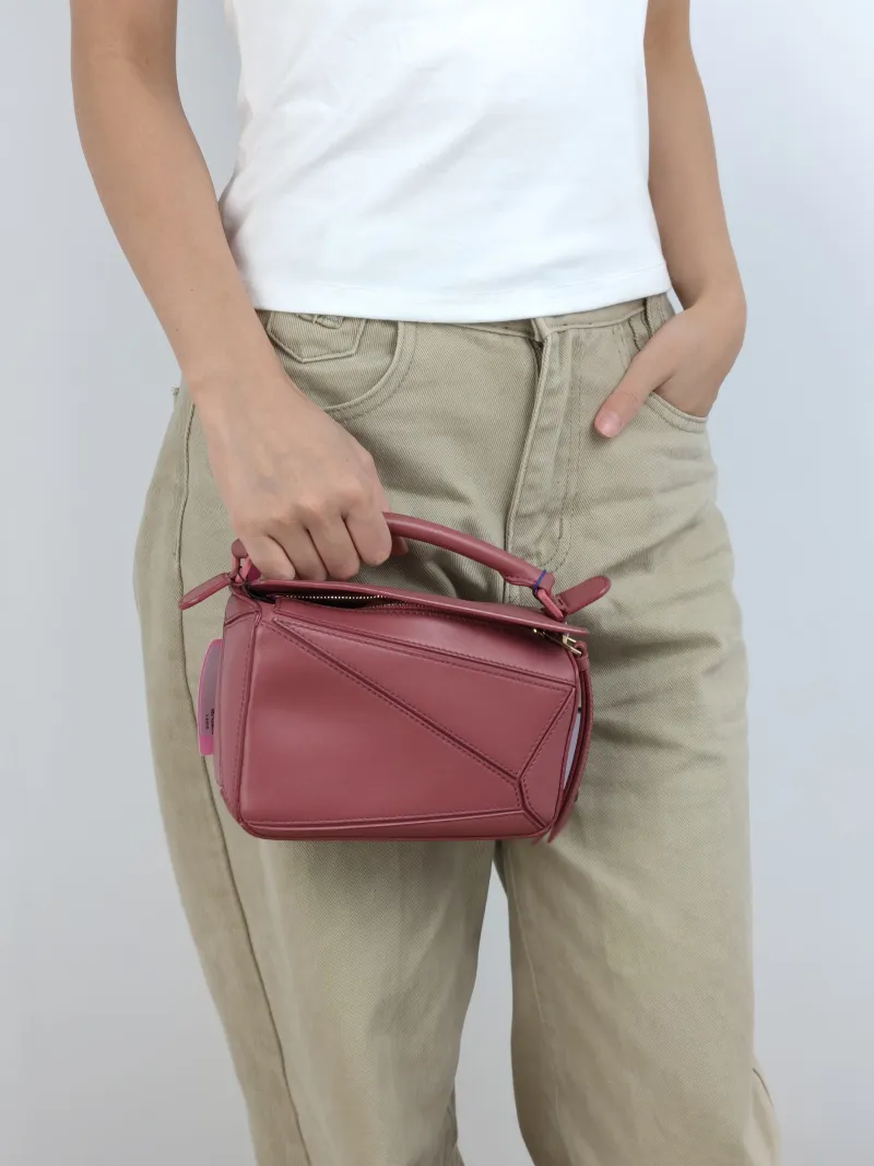 LOEWE Crossbody Bag Puzzle Red Calfskin Mini 18 × 8 × 12.5 cm — on-model view 1 of 3