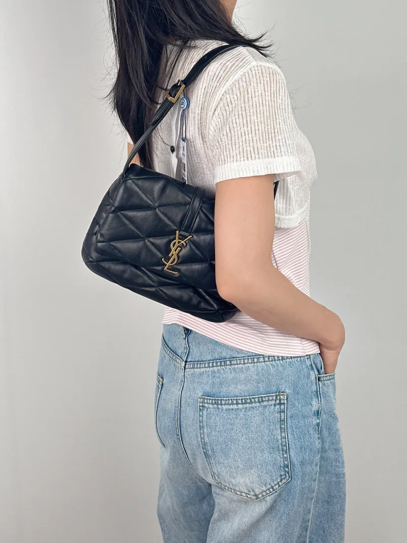 SAINT LAURENT Shoulder Bag LE 57 Shoulder Bag Black Lambskin One Size24 × 4 × 18 cm — on-model view 1 of 3