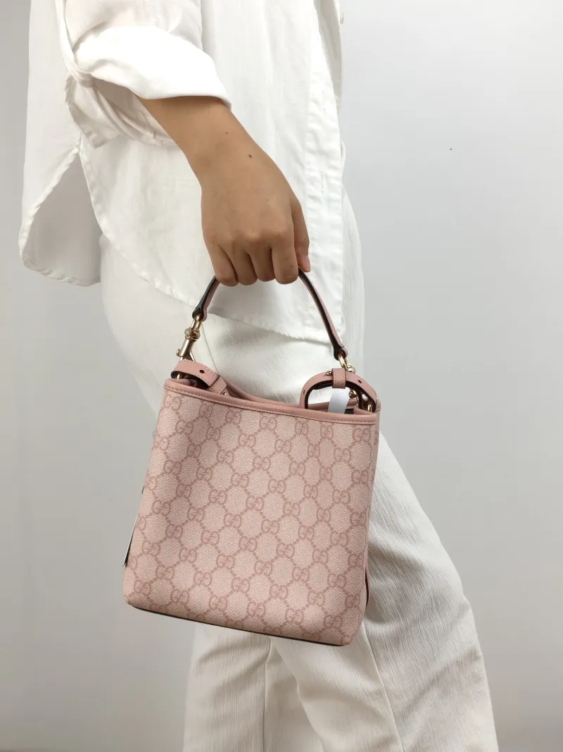GUCCI Crossbody Bag GG Emblem Pink PVC Small 19 × 11 × 18 cm — on-model view 2 of 2