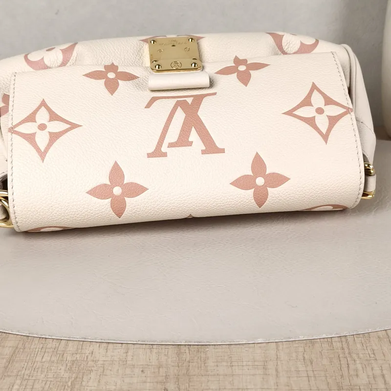 Louis Vuitton Crossbody Bag Favorite White · Pink Empreinte Embossed Calfskin Monogram Medium24 × 9 × 14 cm — detail view 9 of 12