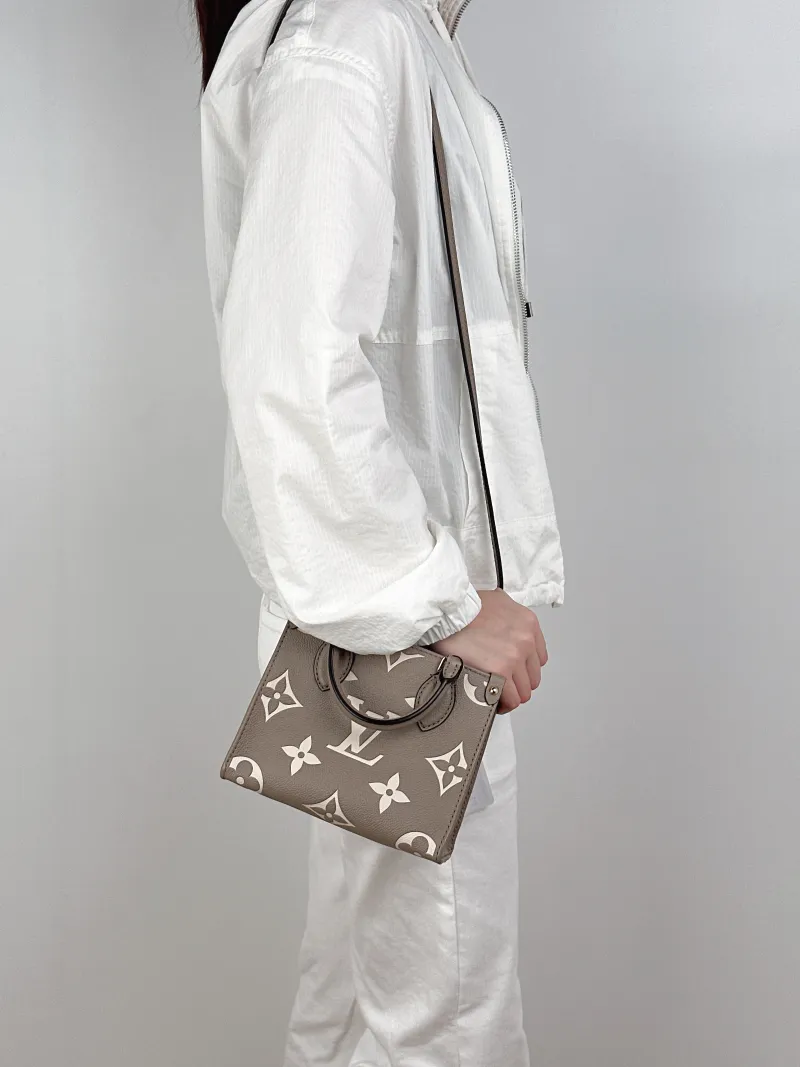Louis Vuitton Crossbody Bag Onthego BB · White Empreinte Embossed Calfskin Monogram BB18 × 8.5 × 15 cm — on-model view 1 of 3