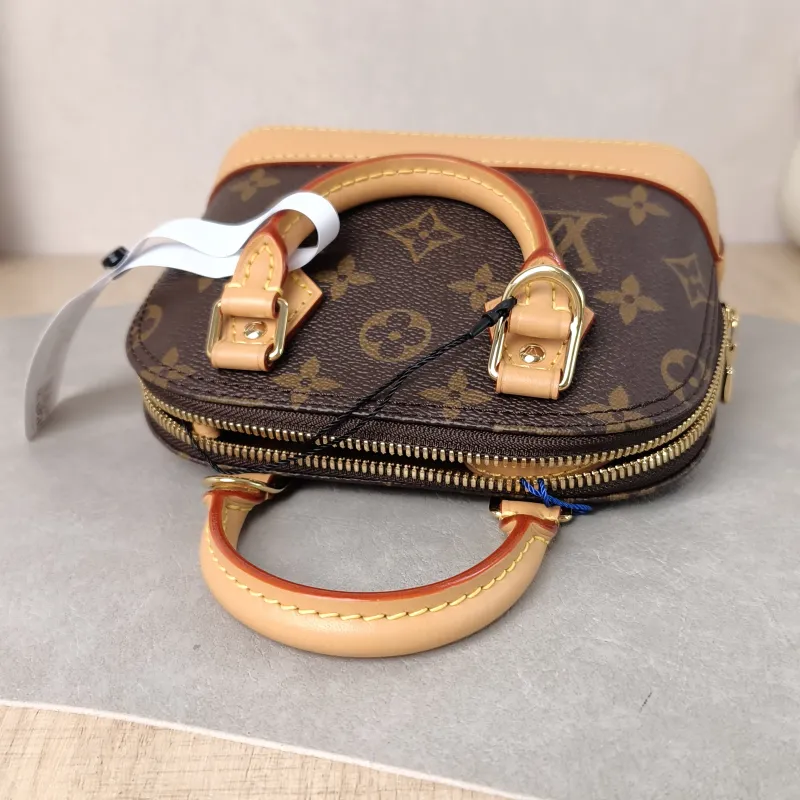 Louis Vuitton Crossbody Bag Alma Nano Monogram PVC nano 18 × 8 × 12 cm — detail view 1 of 10