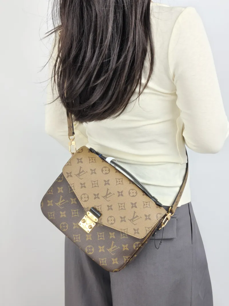Louis Vuitton Crossbody Bag Pochette Métis Monogram Colorblock PVC Medium 25 × 7 × 19 cm — on-model view 1 of 3