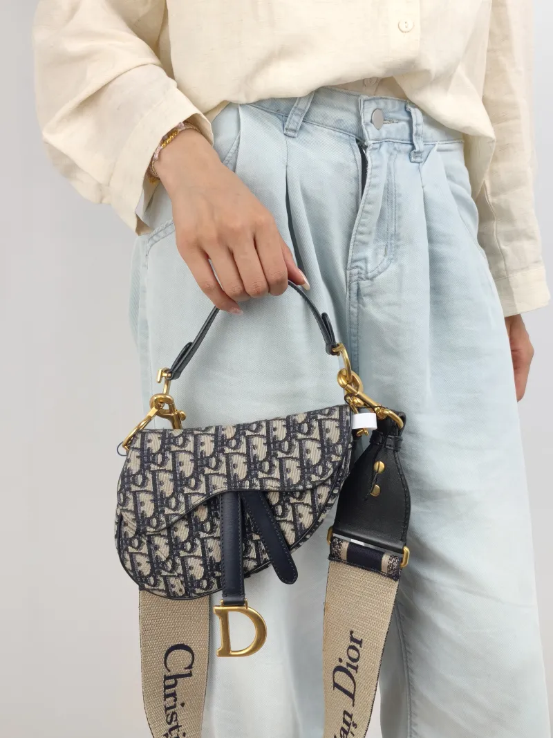 DIOR Top Handle Bag Saddle Blue Canvas Mini 19 × 6 × 15 cm — on-model view 2 of 2