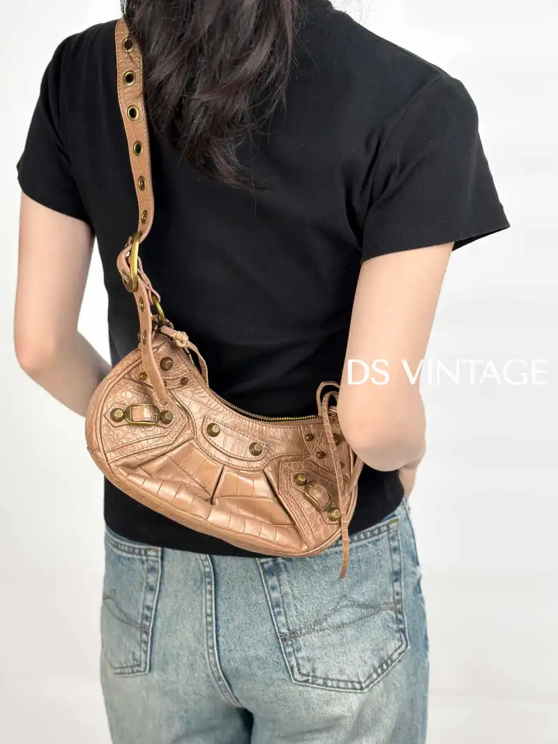 BALENCIAGA Crossbody Bag LE CAGOLE Taupe Calfskin XS26 × 7 × 16 cm — on-model view 2 of 2