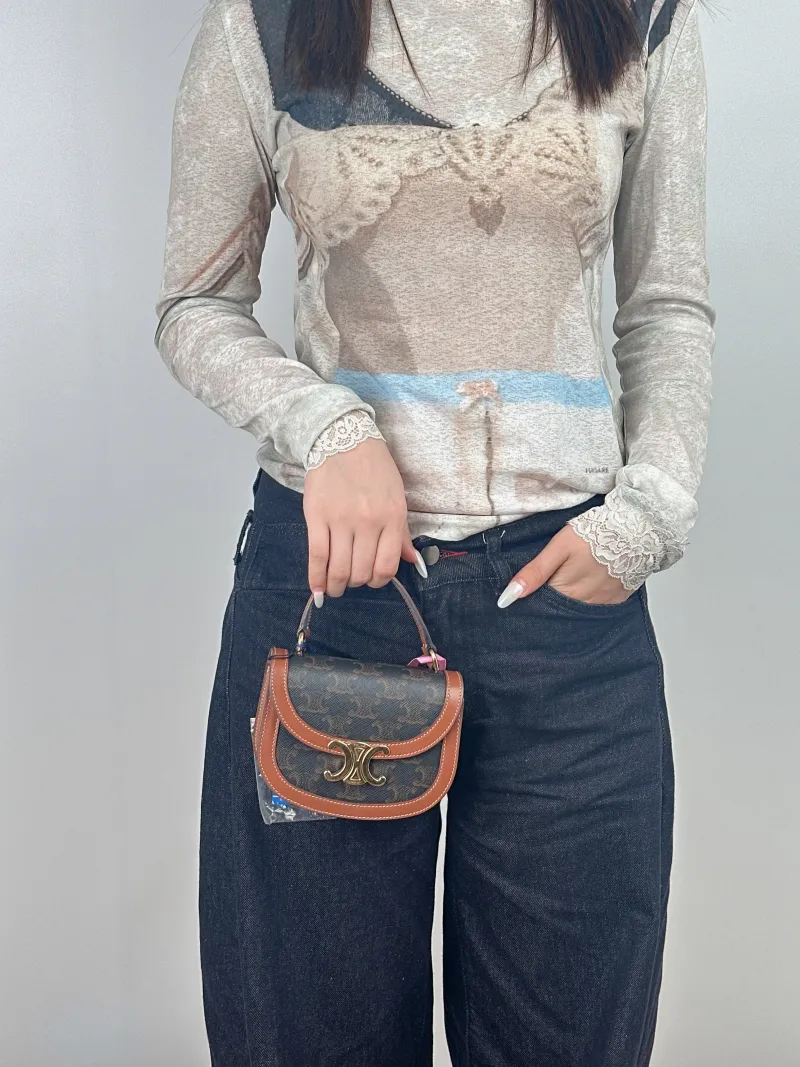 CELINE Crossbody Bag Crossbody Bag Monogram PV Cmini15 × 5 × 11.5 cm — on-model view 1 of 3