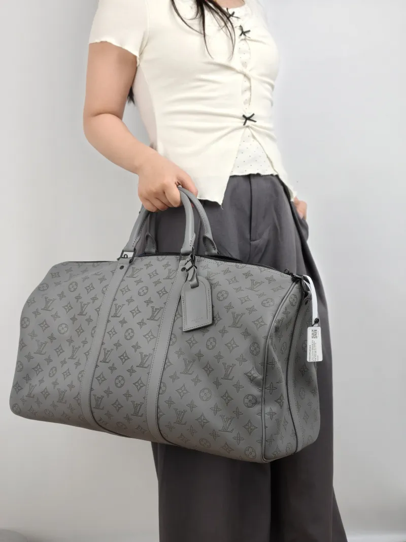 Louis Vuitton Top Handle Bag Keepall 50 Shoulder Strap Edition Grey Calfskin One Size 50 × 23 × 29 cm — on-model view 2 of 2