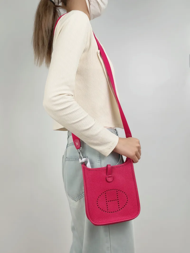 Hermès Crossbody Bag Evelyne Mini 16 Mini 16OD Rose Mexico Taurillon Clemence TC Calfskinmini17 × 5.5 × 18 cm — on-model view 2 of 2