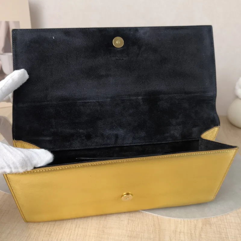 SAINT LAURENT Clutch Clutch Gold Calfskin 27 × 4 × 13 cm — detail view 1 of 12