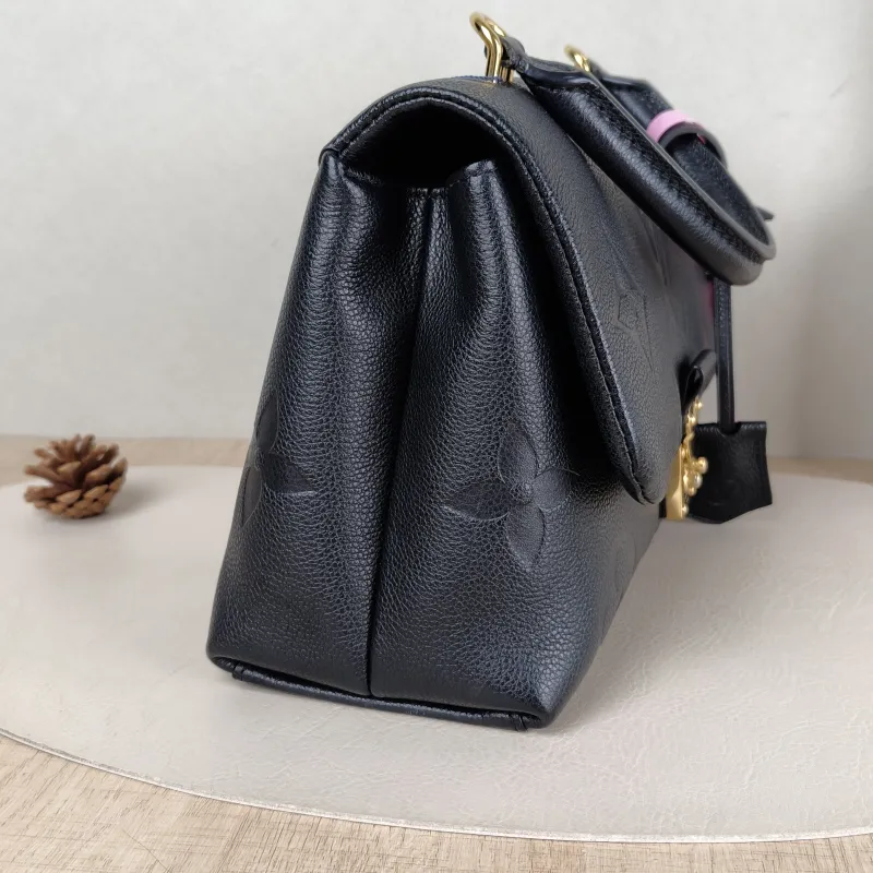 Louis Vuitton Crossbody Bag MADELEINE Black Monogram Empreinte Embossed Calfskin Medium 30 × 11 × 19.5 cm — detail view 9 of 13