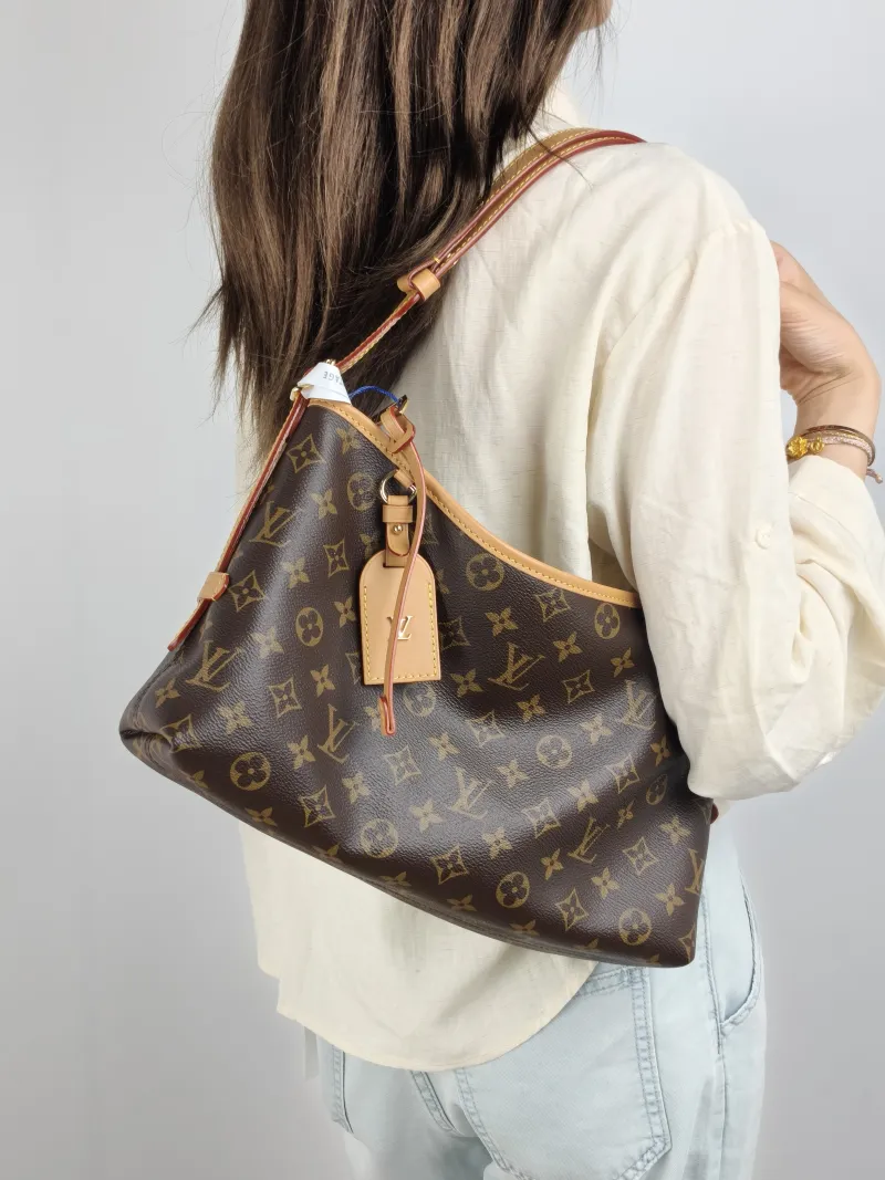 Louis Vuitton Shoulder Bag Carryall East West Monogram PVC 36 × 10 × 19 cm — on-model view 1 of 2