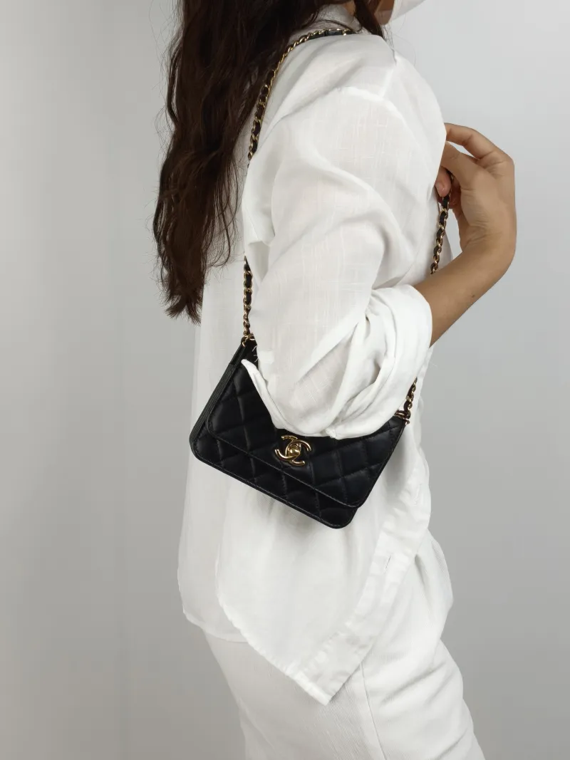 Chanel Crossbody Bag trendy cc woc Black Lambskin Mini 15.5 × 4 × 11 cm 30 — on-model view 1 of 2