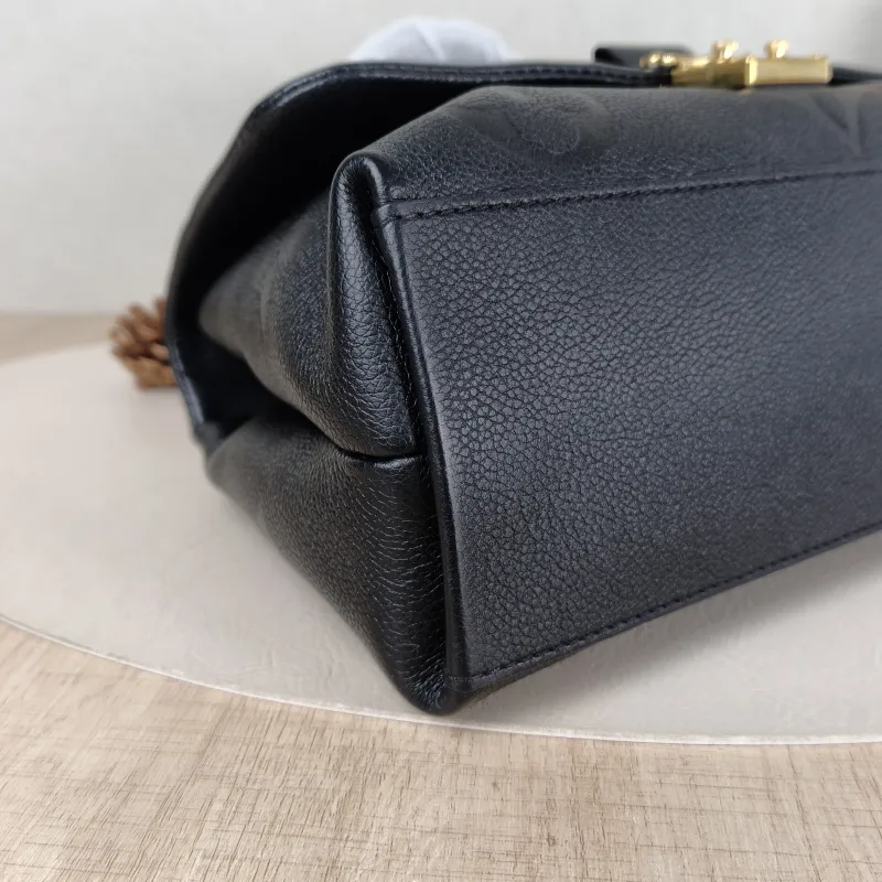 Louis Vuitton Crossbody Bag MADELEINE Black Monogram Empreinte Embossed Calfskin Medium 30 × 11 × 19.5 cm — detail view 7 of 11