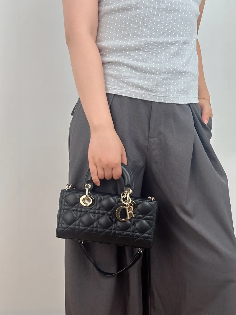 DIOR Top Handle Bag Lady D-Joy Black Lambskin Small 22 × 6 × 11 cm — on-model view 1 of 3
